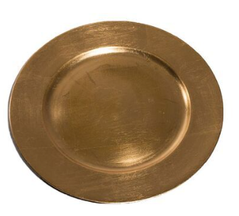 A gold plate is sitting on a white surface