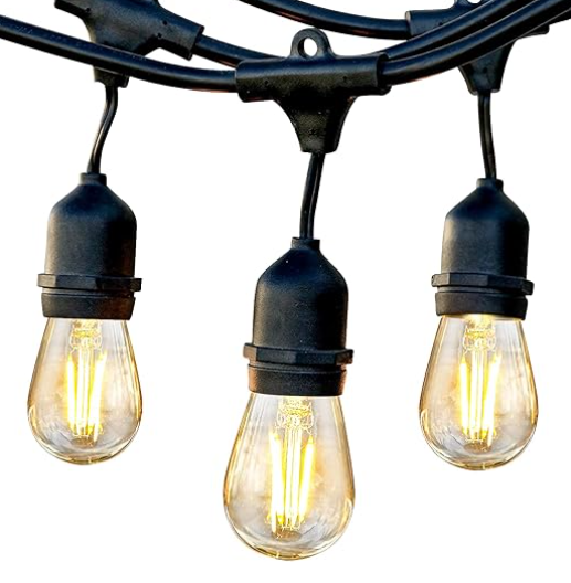 A string of light bulbs hanging from a black wire