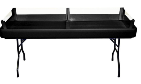 A black table with two clear trays on it