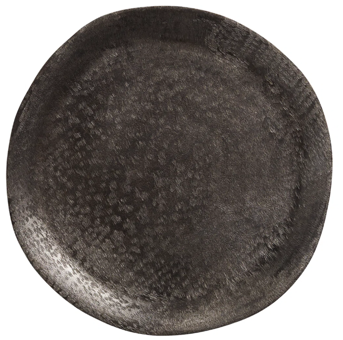 A close up of a black plate on a white background