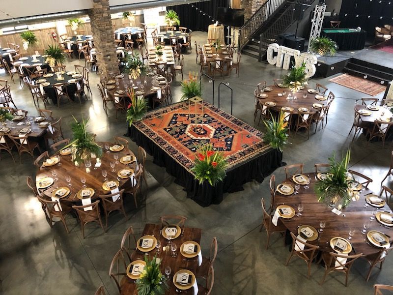 An aerial view of a large room filled with tables and chairs.