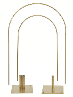 A brass arch with two bases on a white background.