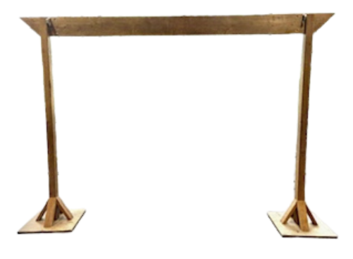 A wooden arch is sitting on a white surface.