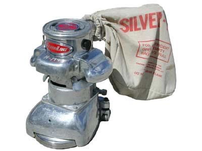 A silver machine with a bag that says silver on it