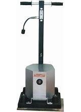 A machine with a microphone attached to it is sitting on top of a table.