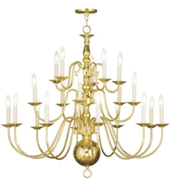 A brass chandelier with many candles hanging from it