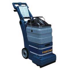 A blue carpet cleaner with wheels and a handle on a white background.