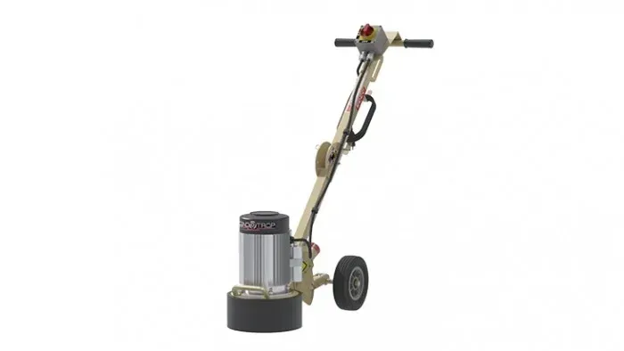 A concrete grinder with wheels and a handle on a white background.