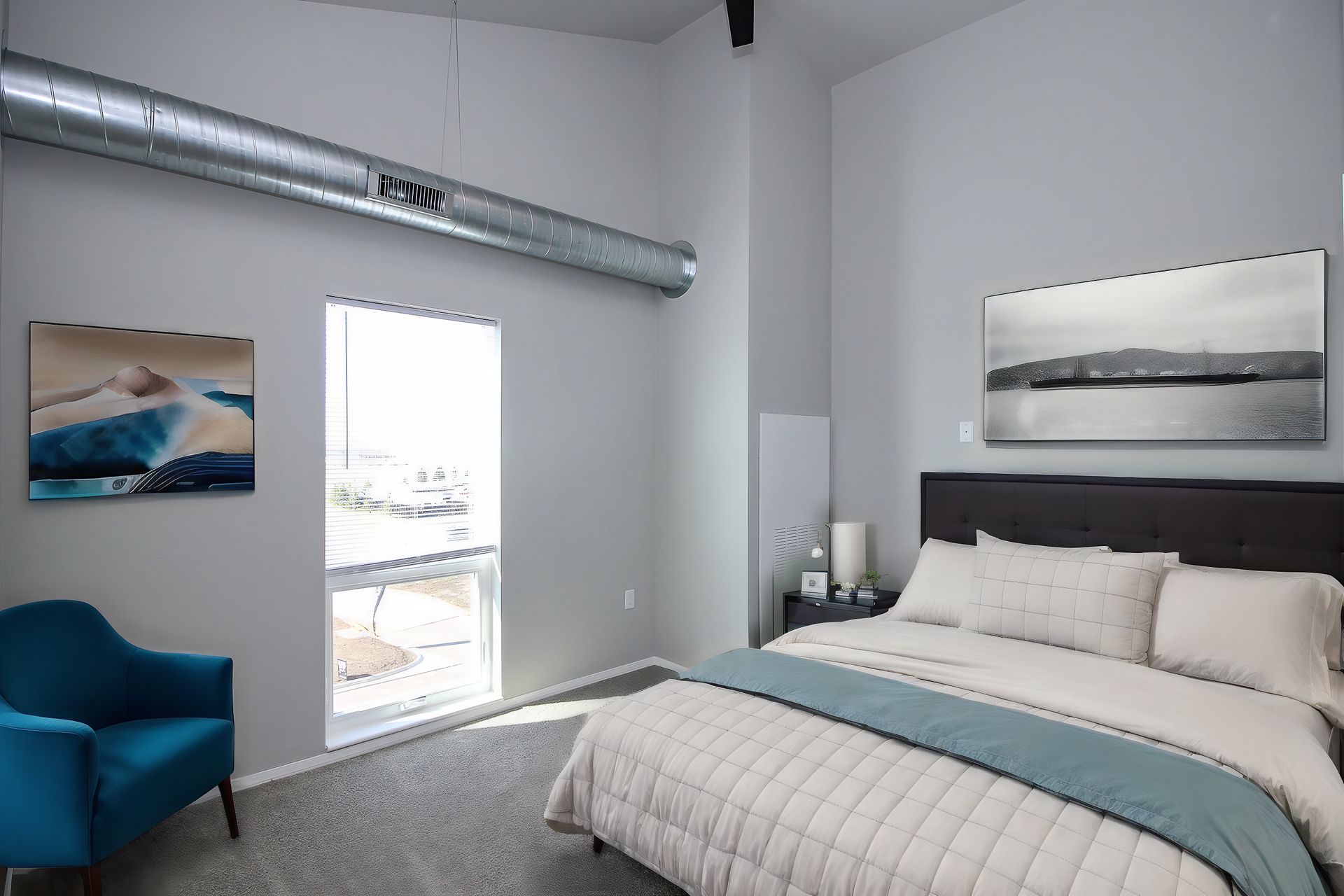 Modern bedroom with gray walls, white bedding, two bedside lamps, and sliding closet doors