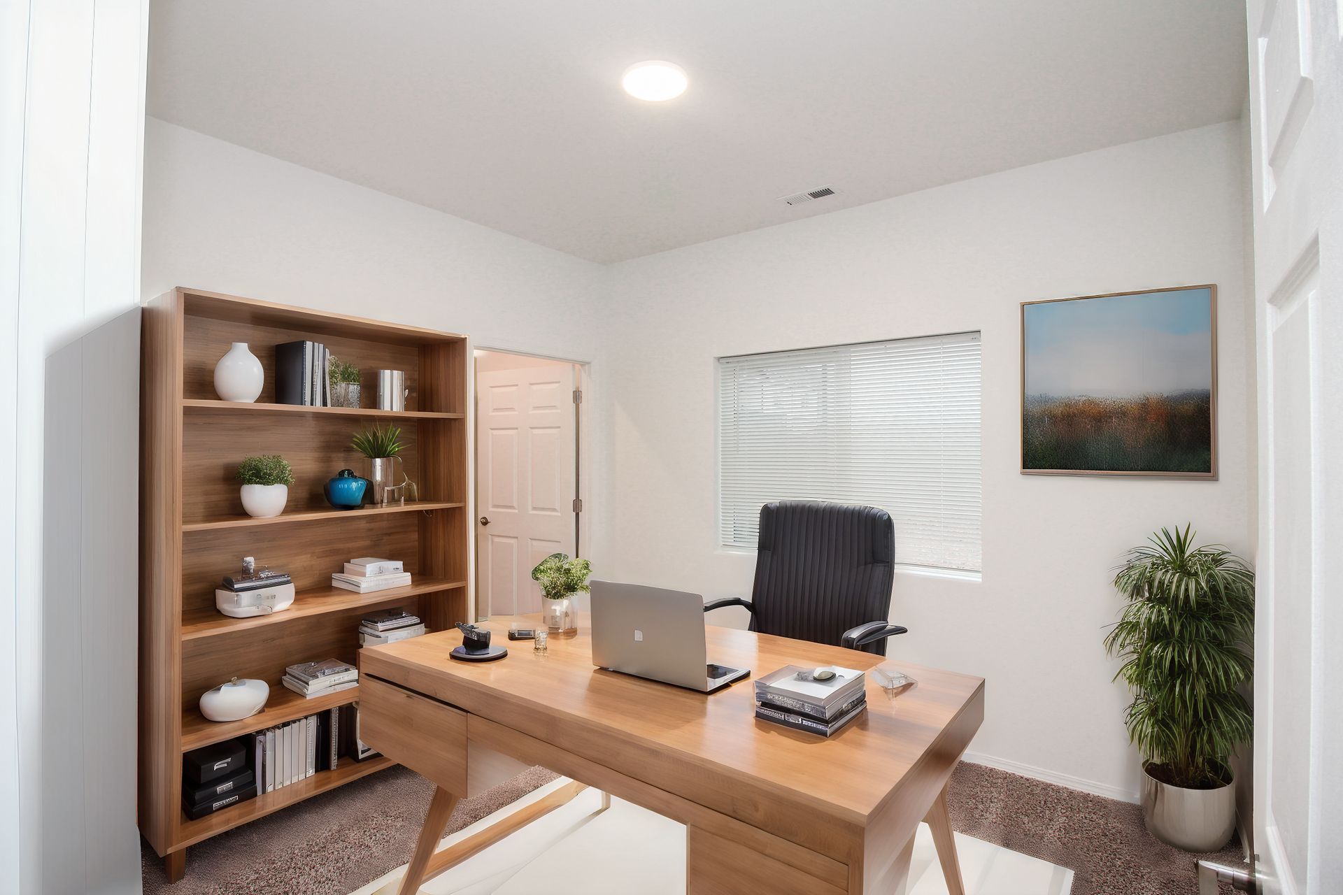Bright home office with wooden desk, bookshelf, laptop, chair, plants, and a window with blinds