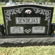 Black granite headstone with the surname SENDEJAS, floral etchings, a portrait insert, and two engraved name plates.