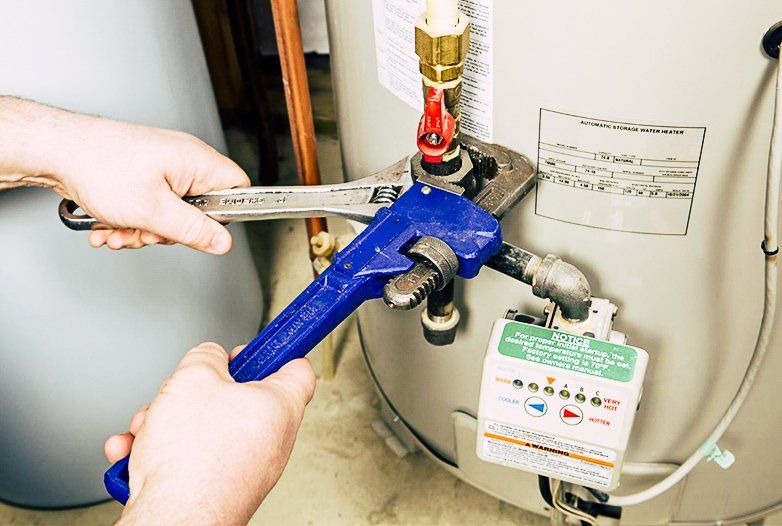 Plumber installing a business hot water system