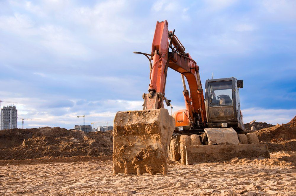 An Excavator is Moving Dirt on a Construction Site — Bennettron Demex in Narrabri, NSW