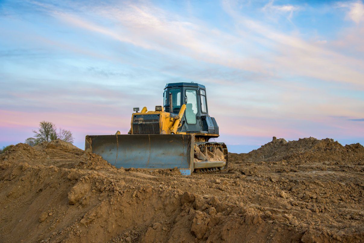A bulldozer is moving dirt on a construction site — Bennettron Demex in Corindi Beach, NSW