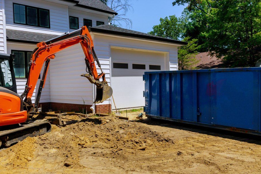 An Excavator is Digging a Hole in Front of a House — Bennettron Demex in Glen Innes, NSW