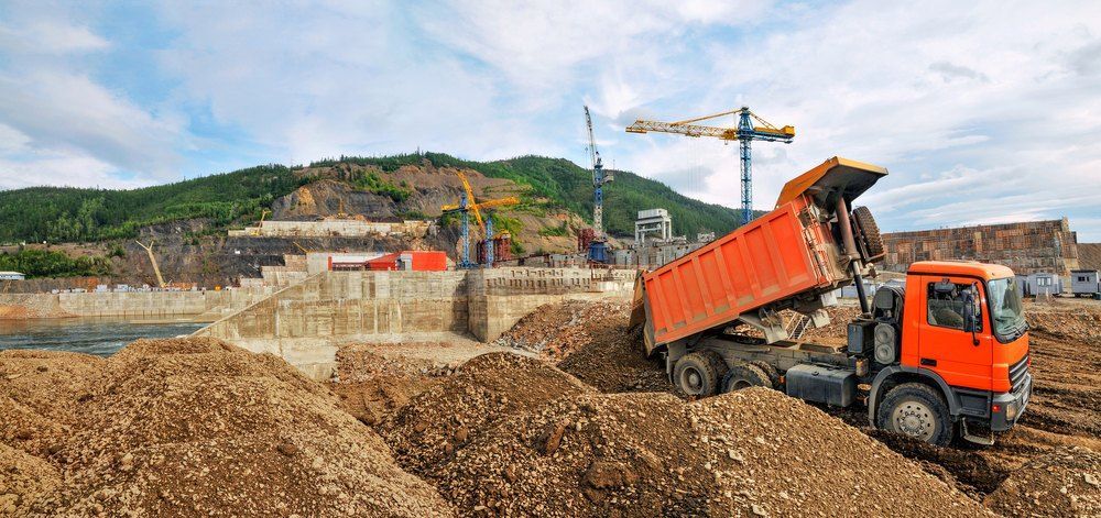 A dump truck is being loaded with dirt at a construction site — Bennettron Demex in Corindi Beach, NSW