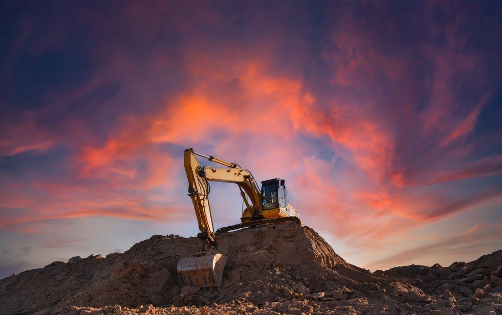 A Yellow Excavator is Sitting on Top of a Pile of Dirt — Bennettron Demex in Narrabri, NSW