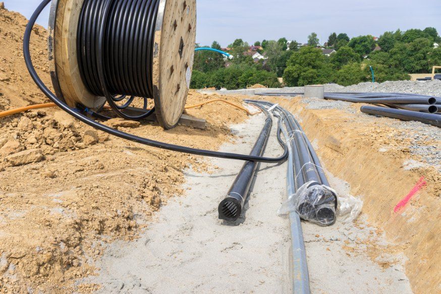 A Spool of Wires is Sitting on Top of a Pile of Dirt — Bennettron Demex in Ballina, NSW