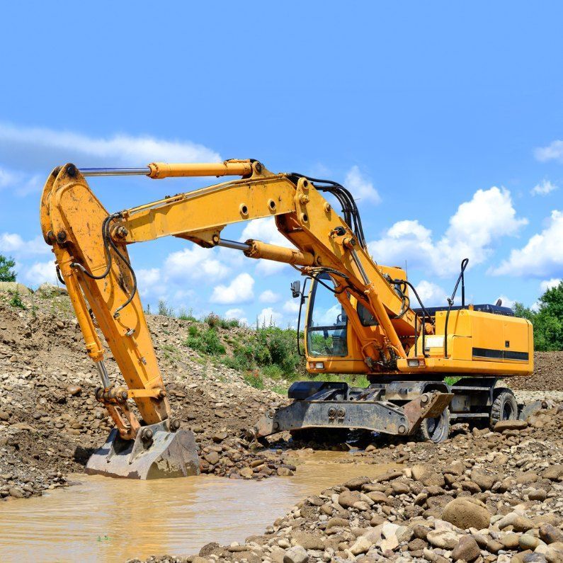 A Yellow Excavator is Digging a Hole in the Ground — Bennettron Demex in Mullumbimby, NSW