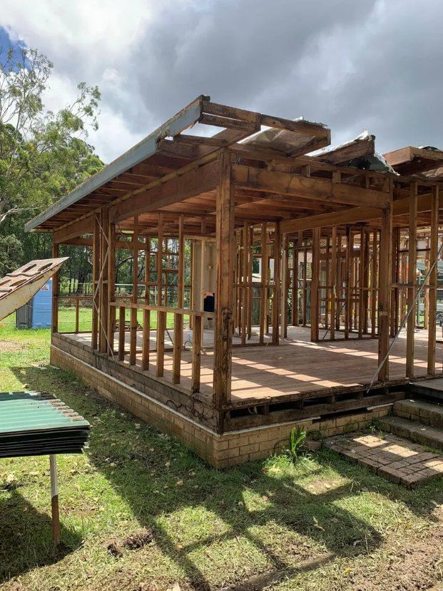 A Wooden House is Being Built in a Grassy Field — Bennettron Demex in Corindi Beach, NSW