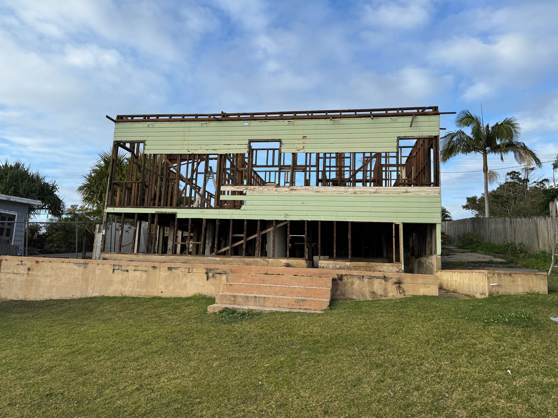 A very old and damaged green house is on lawn— Bennettron Demex in Corindi Beach, NSW