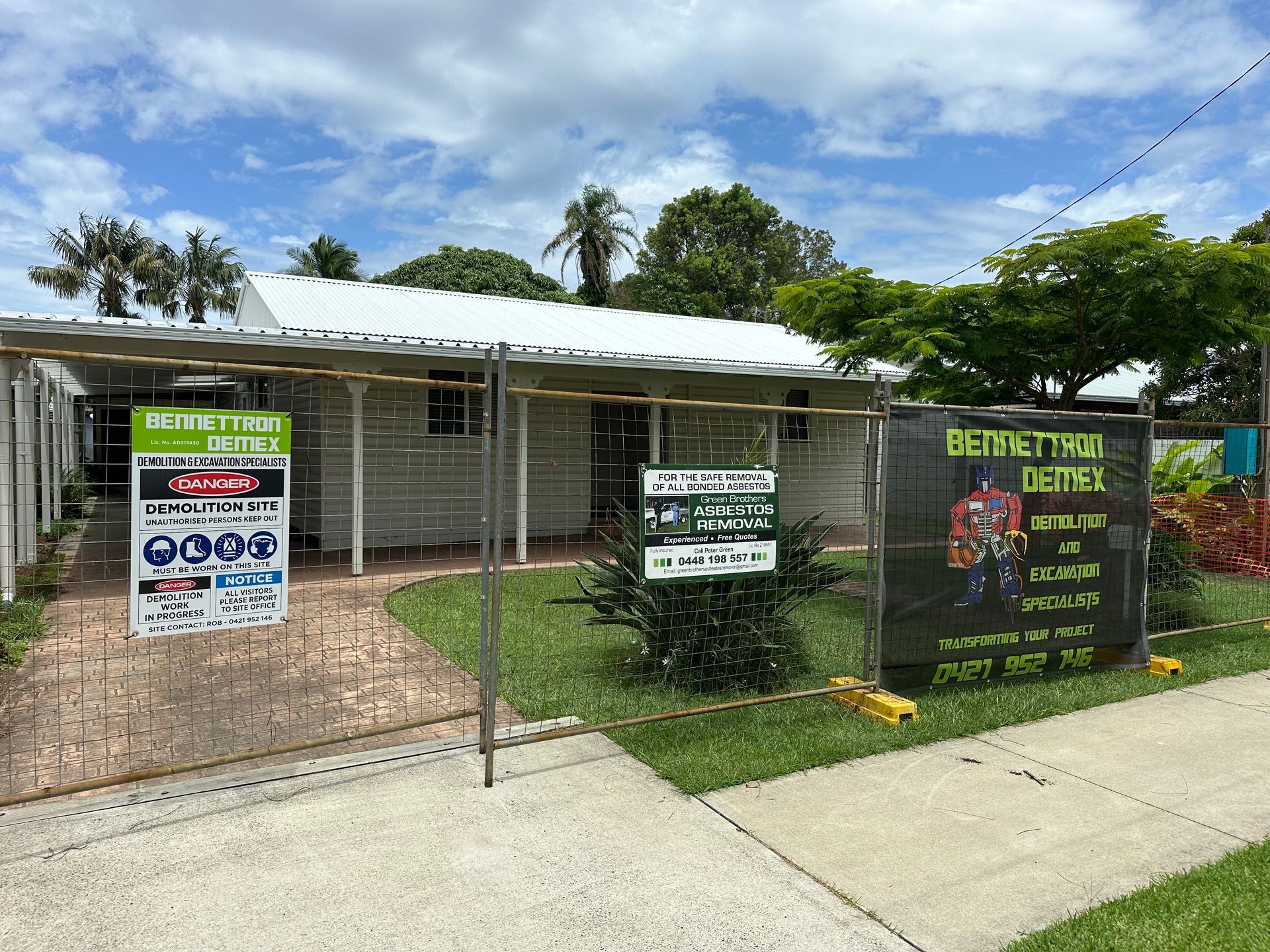 A White cottage looking home is fenced off with metal fence — Bennettron Demex in Corindi Beach, NSW
