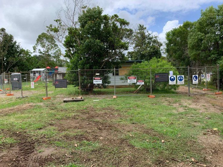 A Large Grassy Field With a Fence and Trees in the Background — Bennettron Demex in Corindi Beach, NSW