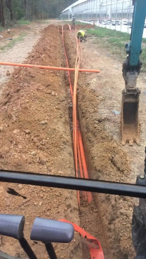 A Tractor is Digging a Trench in the Dirt — Bennettron Demex in Casino, NSW