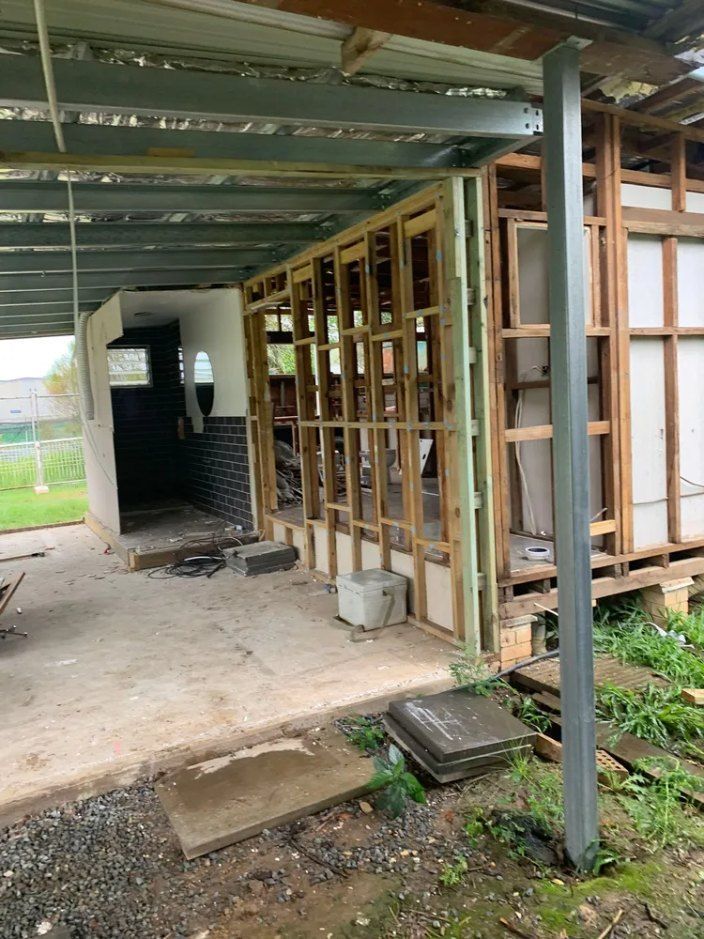 A House is Being Built With Wooden Frames and a Metal Roof — Bennettron Demex in Corindi Beach, NSW