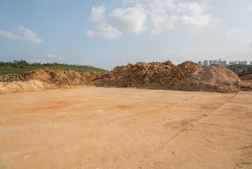 A Large Pile of Dirt is Sitting in the Middle of a Dirt Field — Bennettron Demex in Inverell, NSW