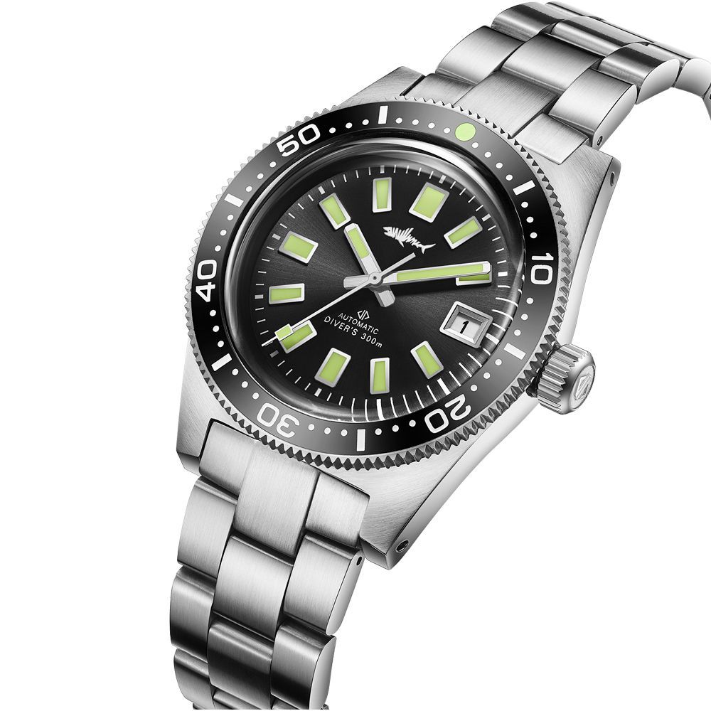 A silver watch with a black face and green hands on a white background.