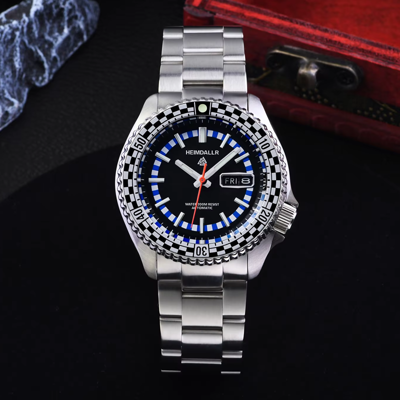 A silver watch with a black face and blue numbers shows that it is friday the 15th
