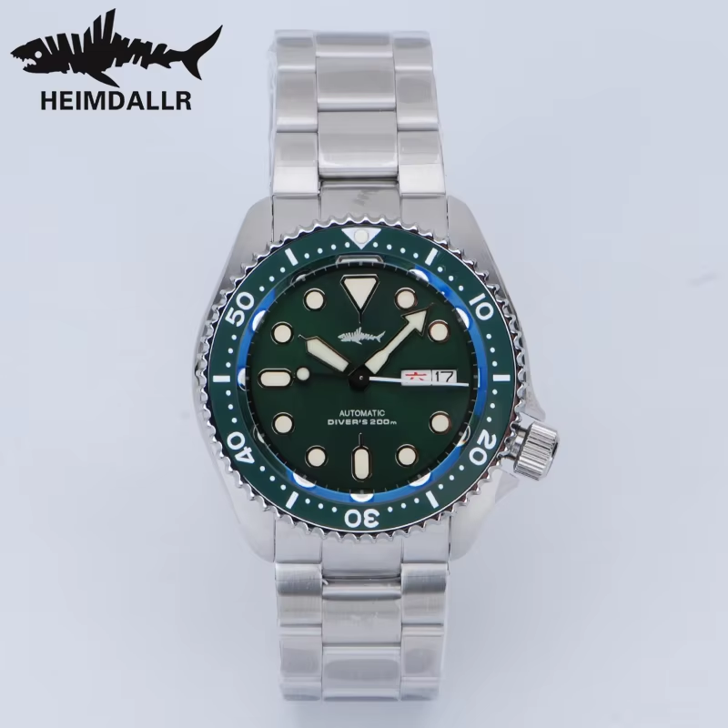 A stainless steel wrist watch with a green face
