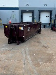 Roll-off dumpster placed at commercial loading docks.