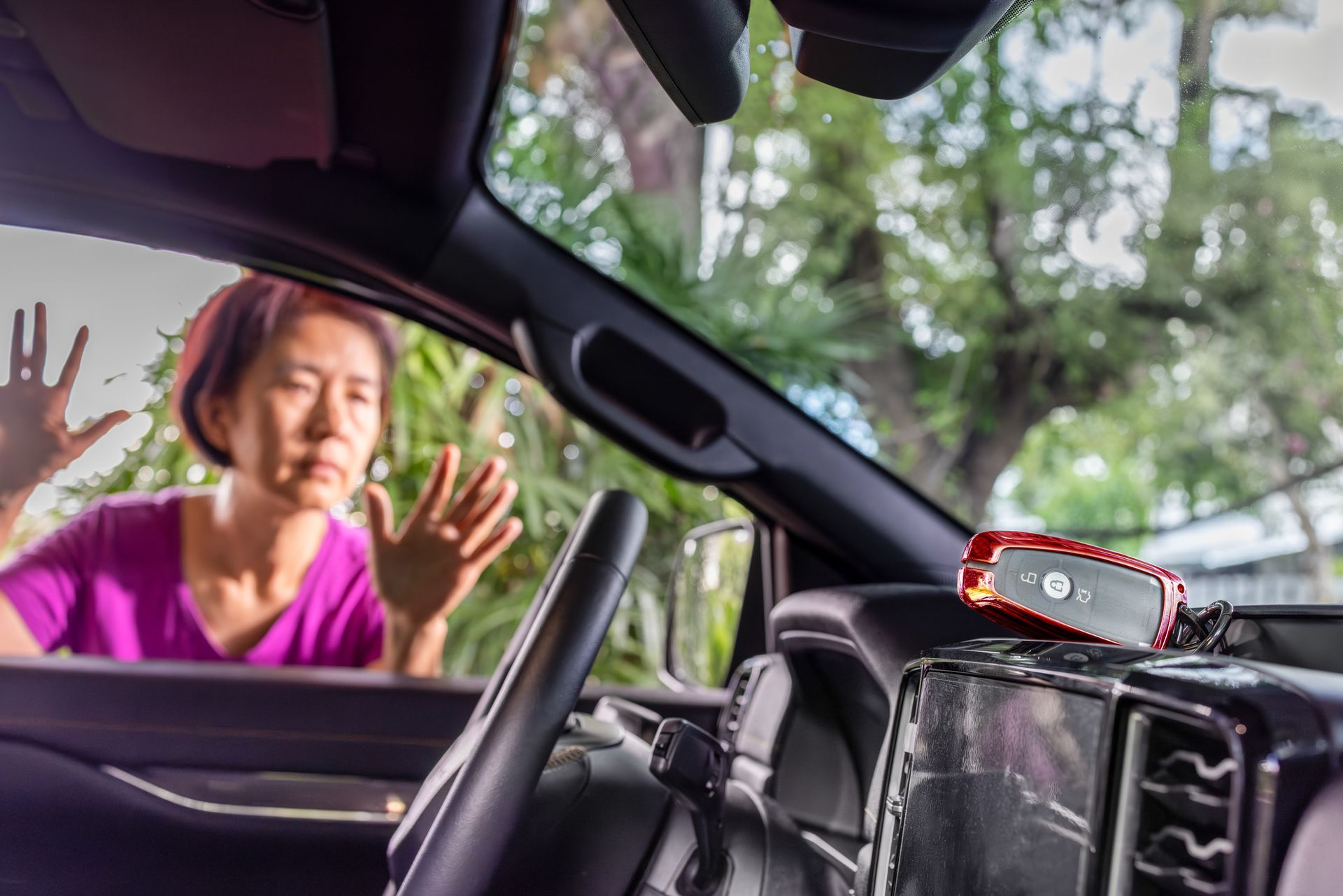 Senior asian woman forgot her key inside locked car - Auto Locksmith In Caloundra, QLD