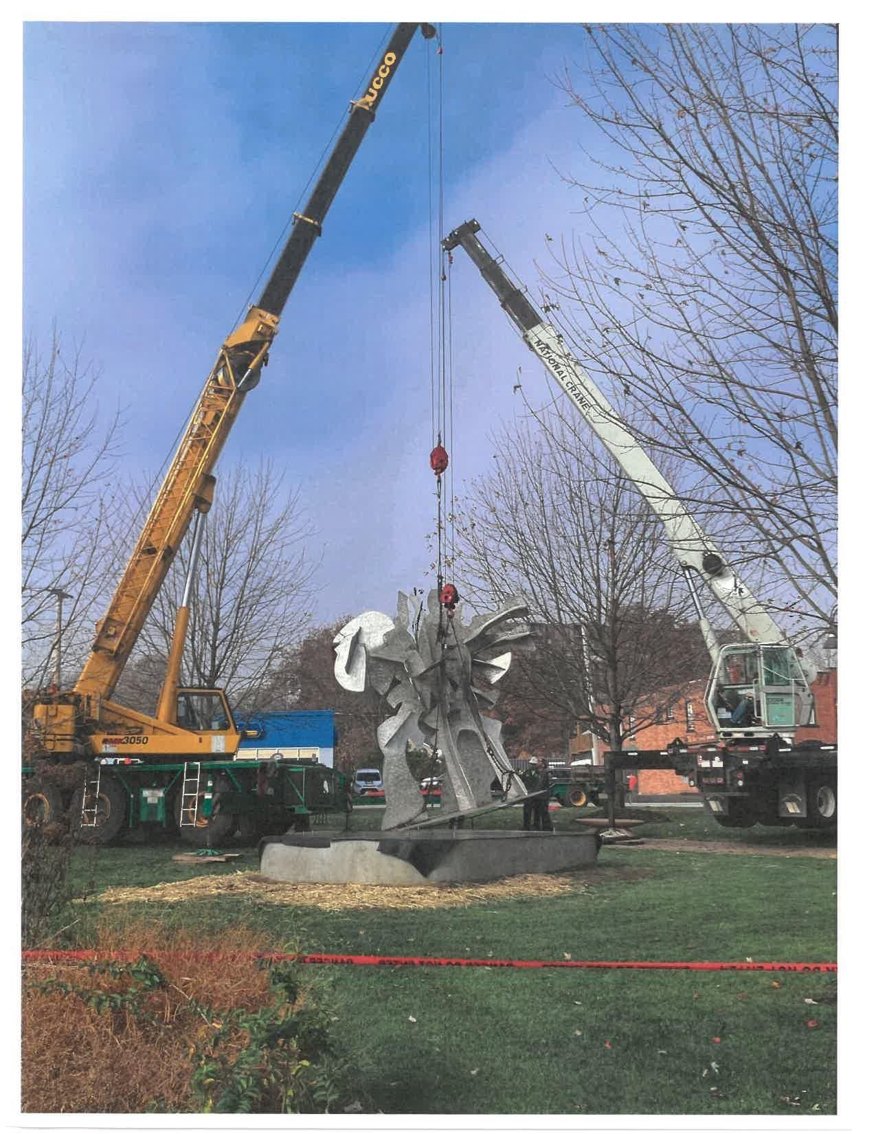 A Large Sculpture Is Being Lifted by a Crane — Akron, OH — Frank Lucco Company