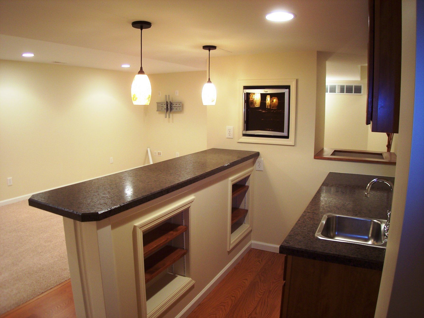 a kitchen with a large counter top and a sink