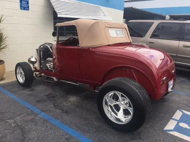 Red Car Parked In Handicapped Parking Lot - Long Beach, CA - Auto-B-Craft Collision Center