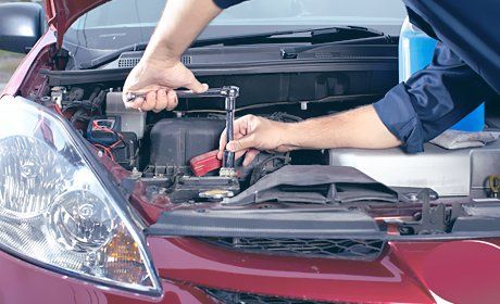 Mechanic repairing a car engine