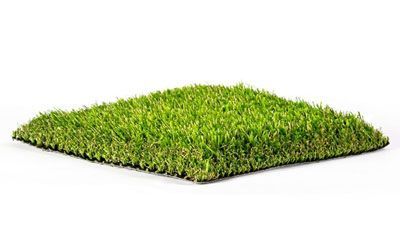 Square of artificial green turf on a white background.