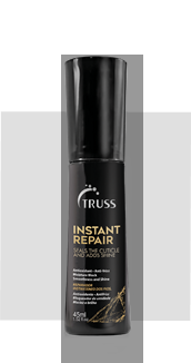 Una botella negra de spray reparador instantáneo de armaduras sobre un fondo blanco.