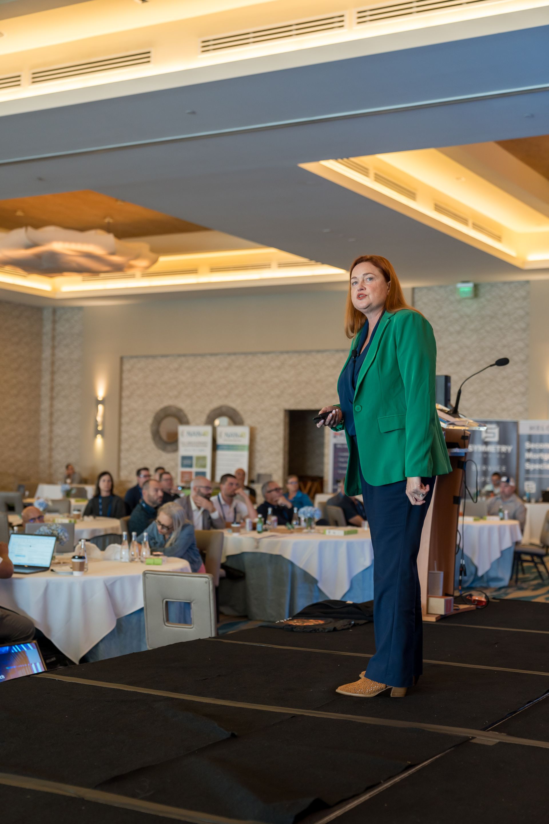 Robin on stage about the power of video for scaling high-end businesses.