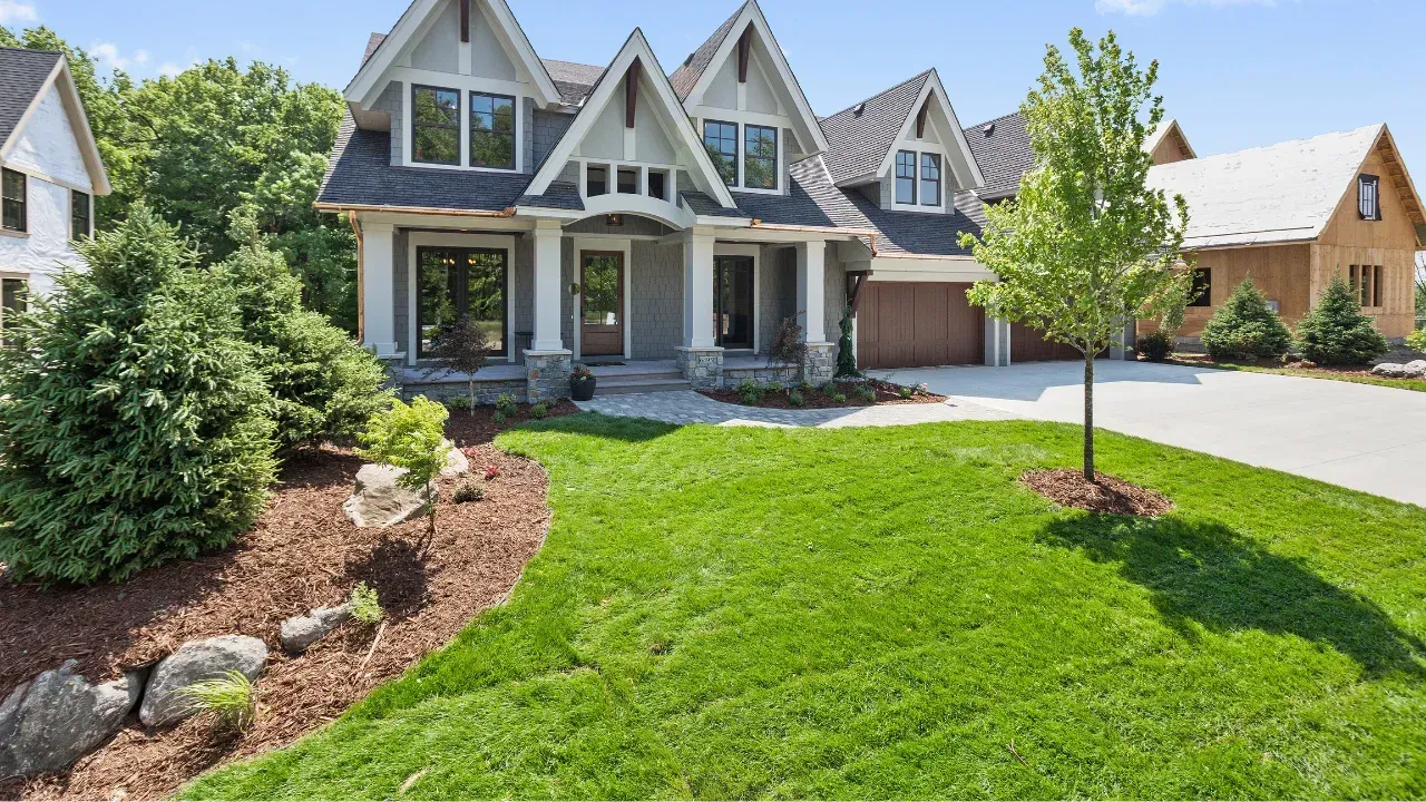 a large house with a landscaped front yard