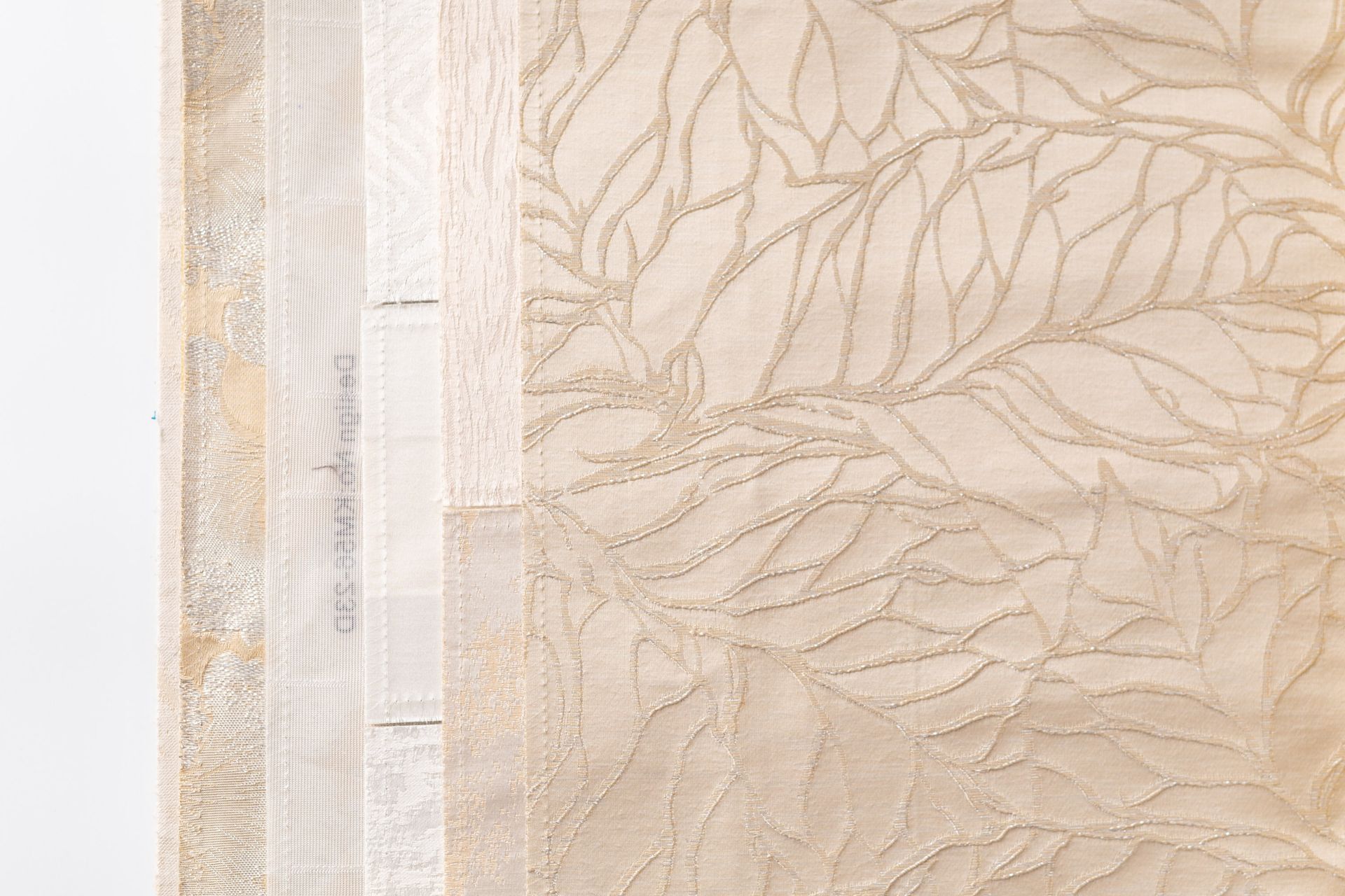 A close up of a piece of fabric with a leaf pattern on it.