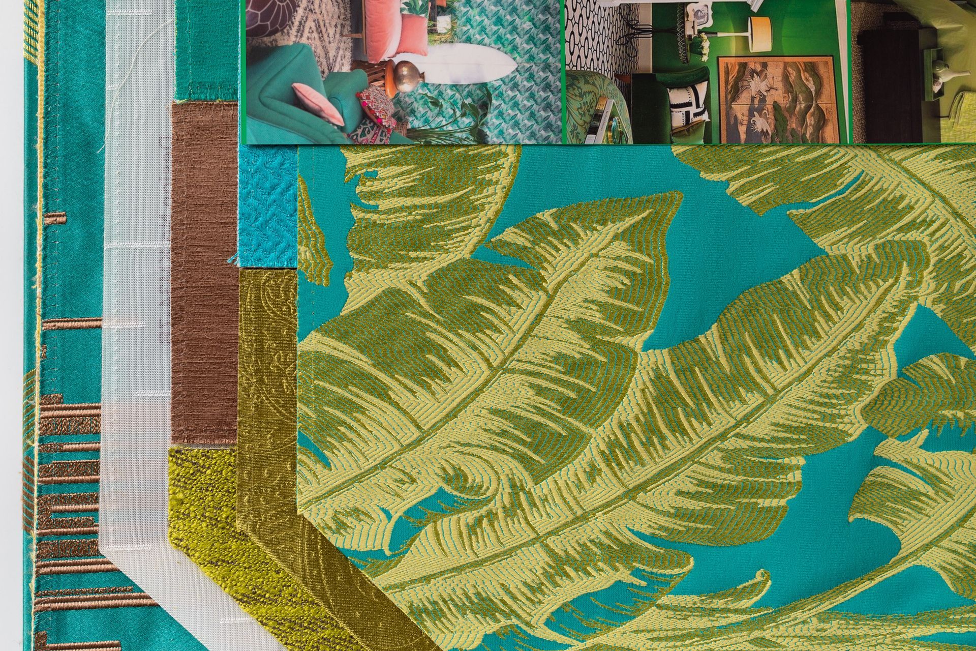 A collage of green and blue fabrics with leaves on them