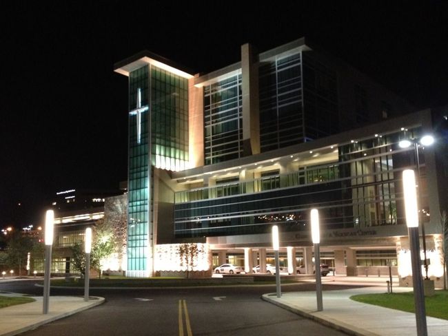 A large building with a cross on the top of it