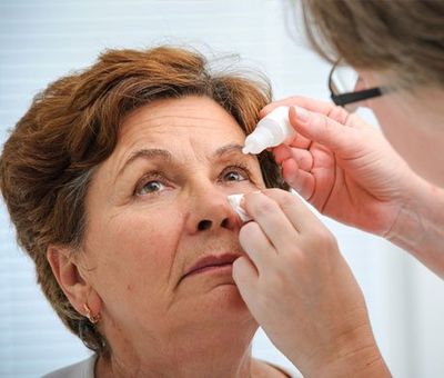 Senior Woman Applying Eye Drops — Oklahoma City, OK — Southwest Eye Clinic