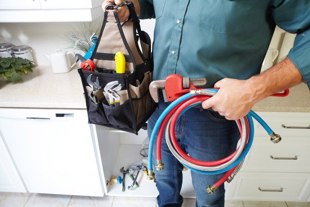 Plumber with Tools — Plumber in Rockhampton, QLD