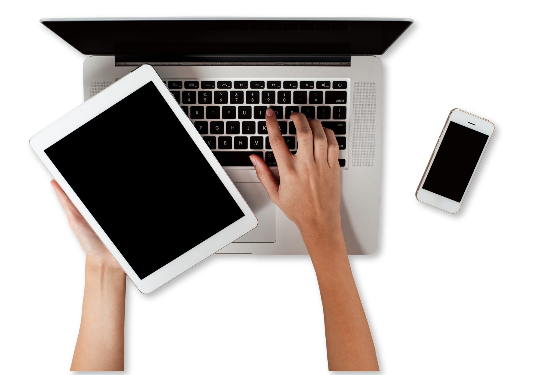 Hands typing on laptop, holding a tablet, and a smartphone on a white surface.