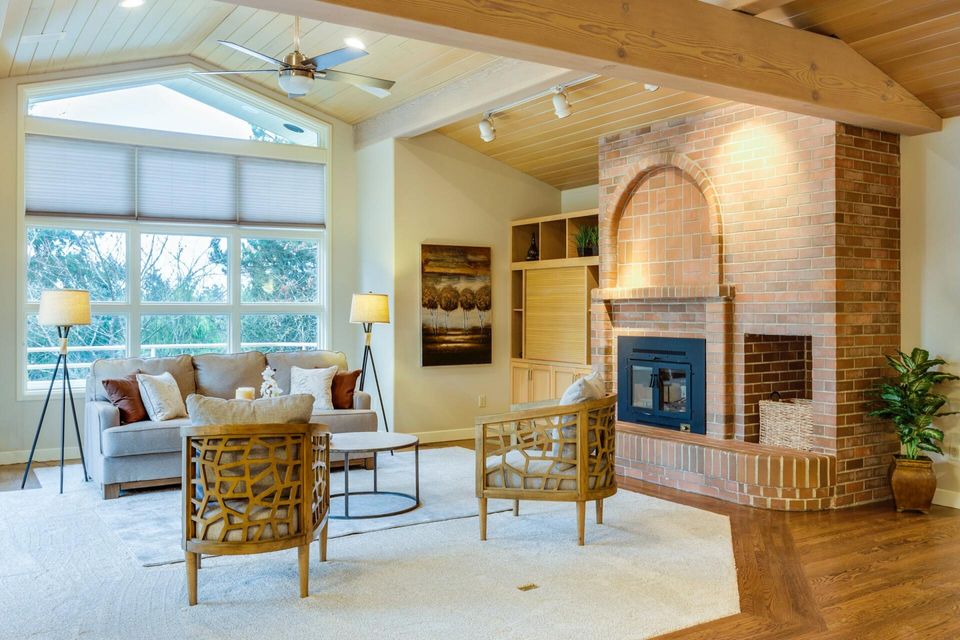 Brick wall in living room with fireplace